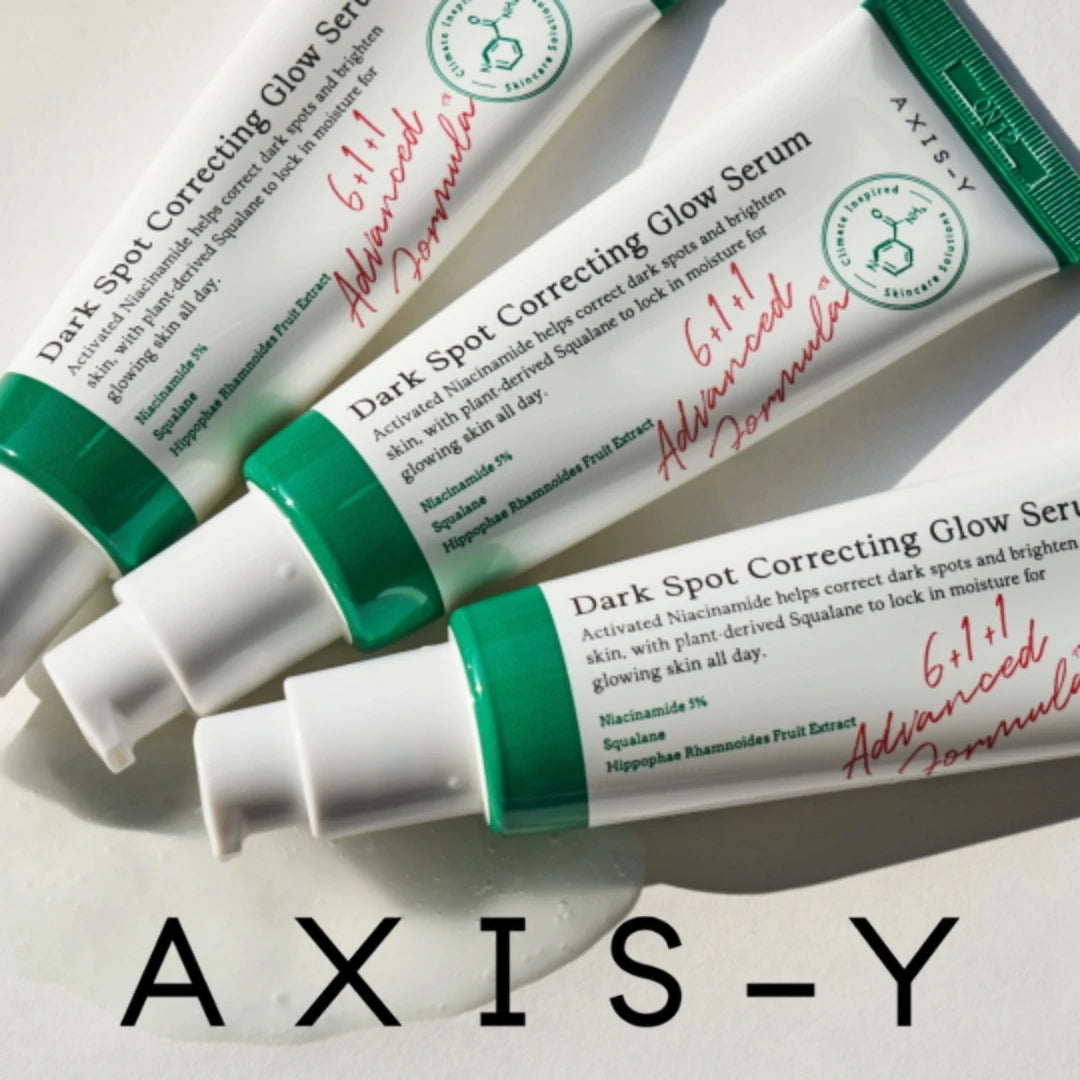 Axis Y Dark Spot Glow Serum outside of box on wooden table