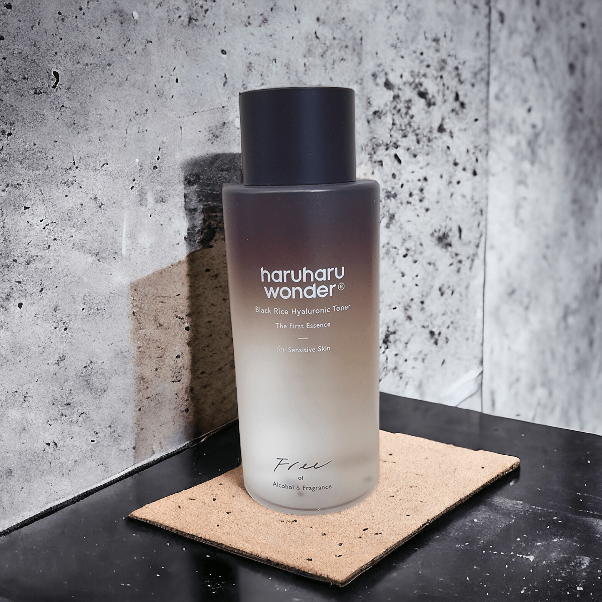 Haruharu WONDER - Black Rice Hyaluronic Toner Fragrance Free on a black counter with white marble background